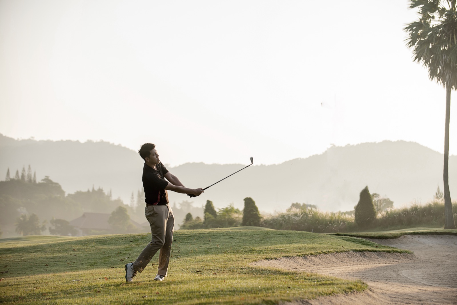 A golfer mid-swing
